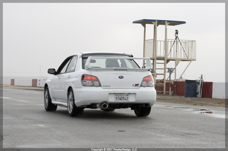 Chris' White STI leaving the pits