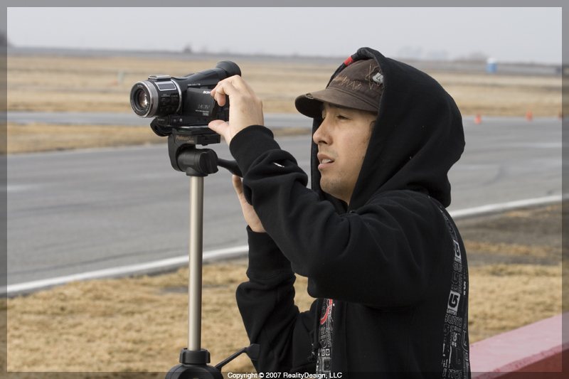 Aaron filming at the race track